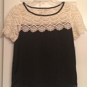 Lace detail top with black polyester bottom.